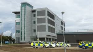 Building with police cars infront