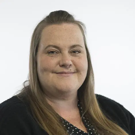 Image of Lucy Smith wearing black top with white spots and black cardigan