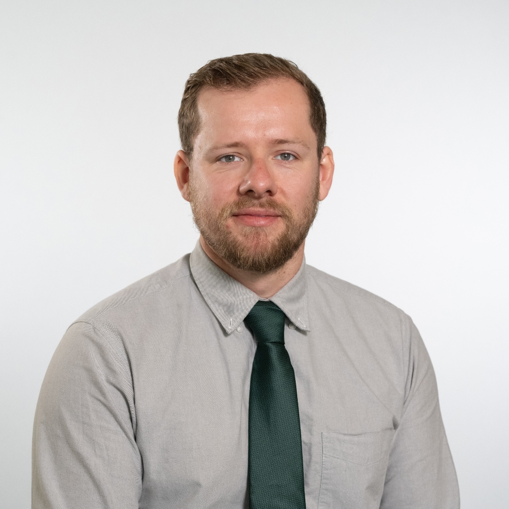 Councillor Matt Bentley wearing grey shirt and dark green tie