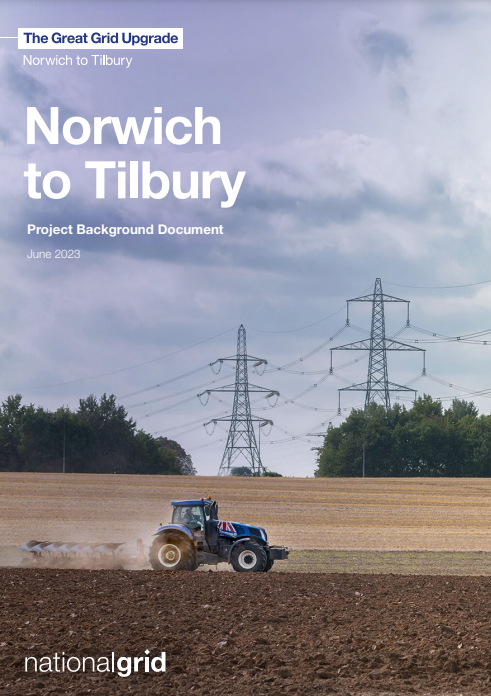 A blue tractor ploughs a field with pylons in the background