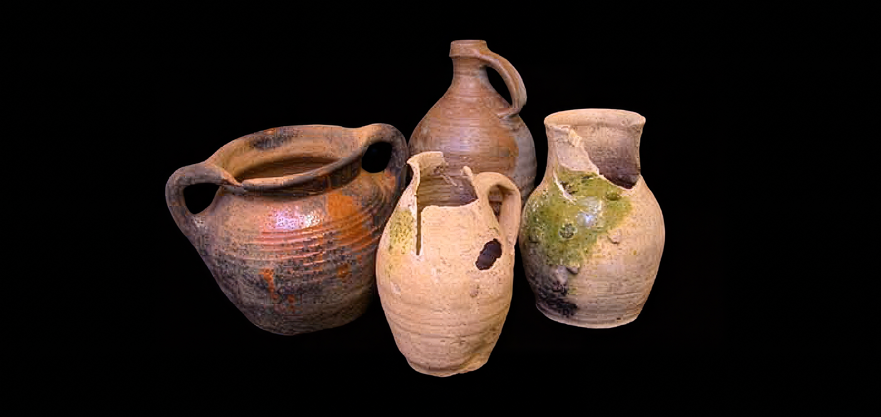 A collection of four pieces of ancient pottery