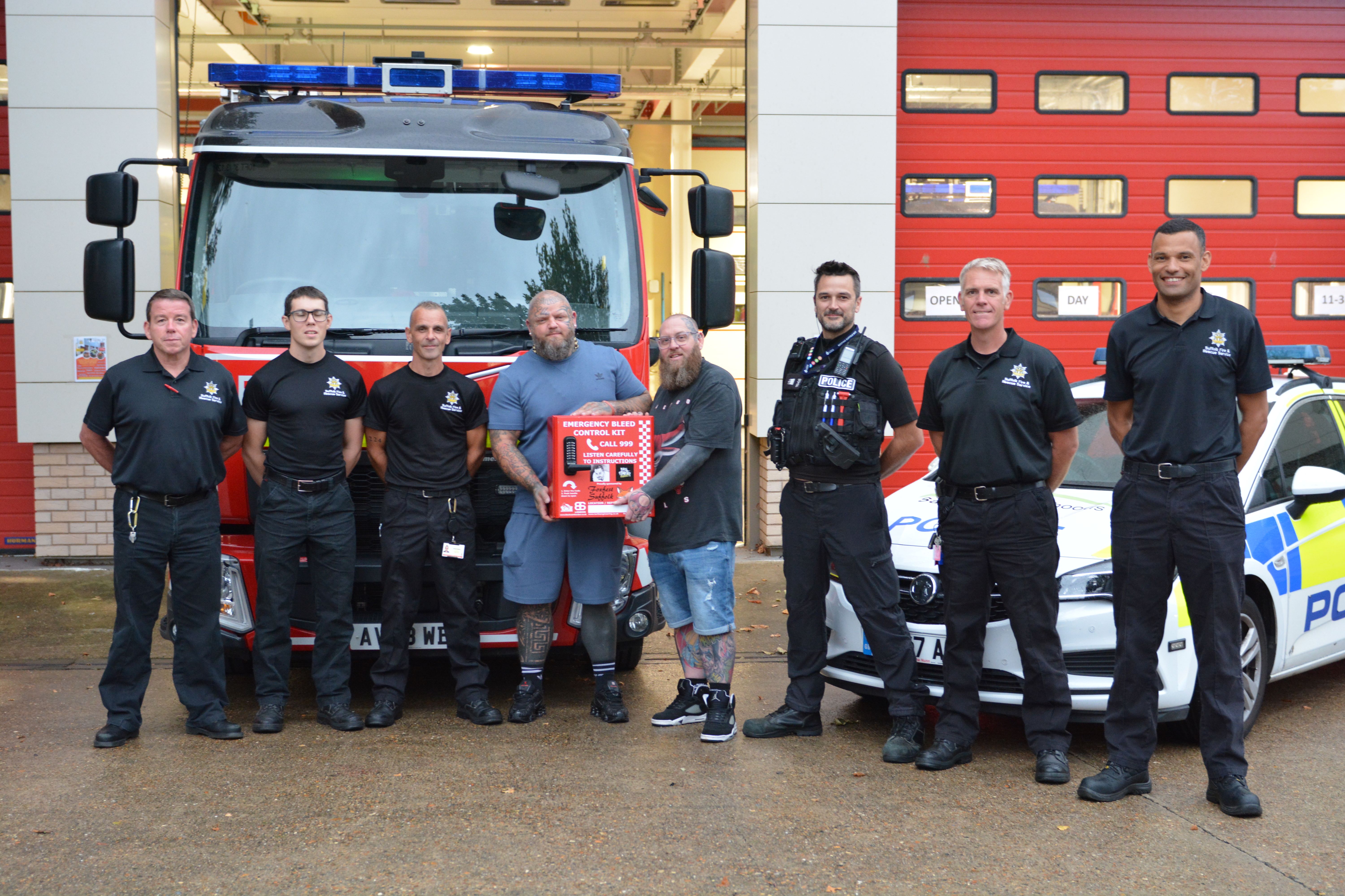 Paul Stansby and Jamie Hart with firefighters and police officers from Princes Street station.