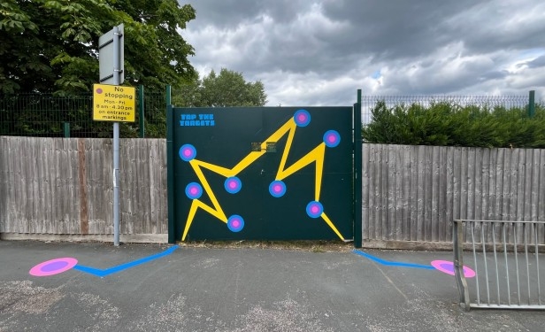 A painted gate and pavement