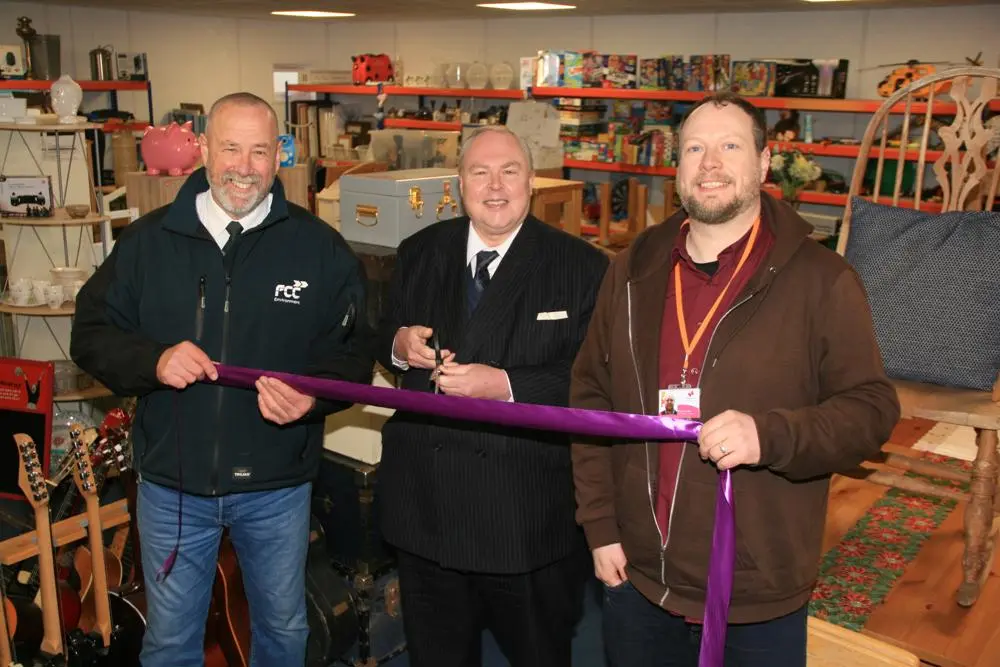 Paul Smith of FCC, left, Councillor Richard Smith and Paul Sinclair of The Benjamin Foundation cut the ribbon to mark the opening of the new Re-use shop at Foxhall Recycling Centre. 