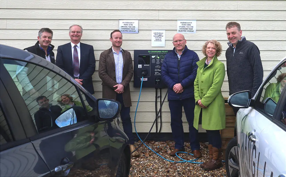 (L-R) Richard Seppings, Founder of Anglia Car Charging / Peter Frost, SCC Environment Strategy Officer / Cllr Richard Rout, SCC Deputy Leader / David Edwards, Trustee of Risby Village Hall Charity Trust / Sophie Flux, Secretary of Risby Village Hall Charity Trust / Dr Matthew Ling, SCC Environment Strategy Manager pose in front of new charging points at Risby Village Hall.