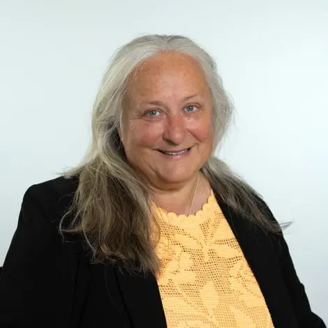 Cllr Ruth Leach wearing black jacket and yellow top