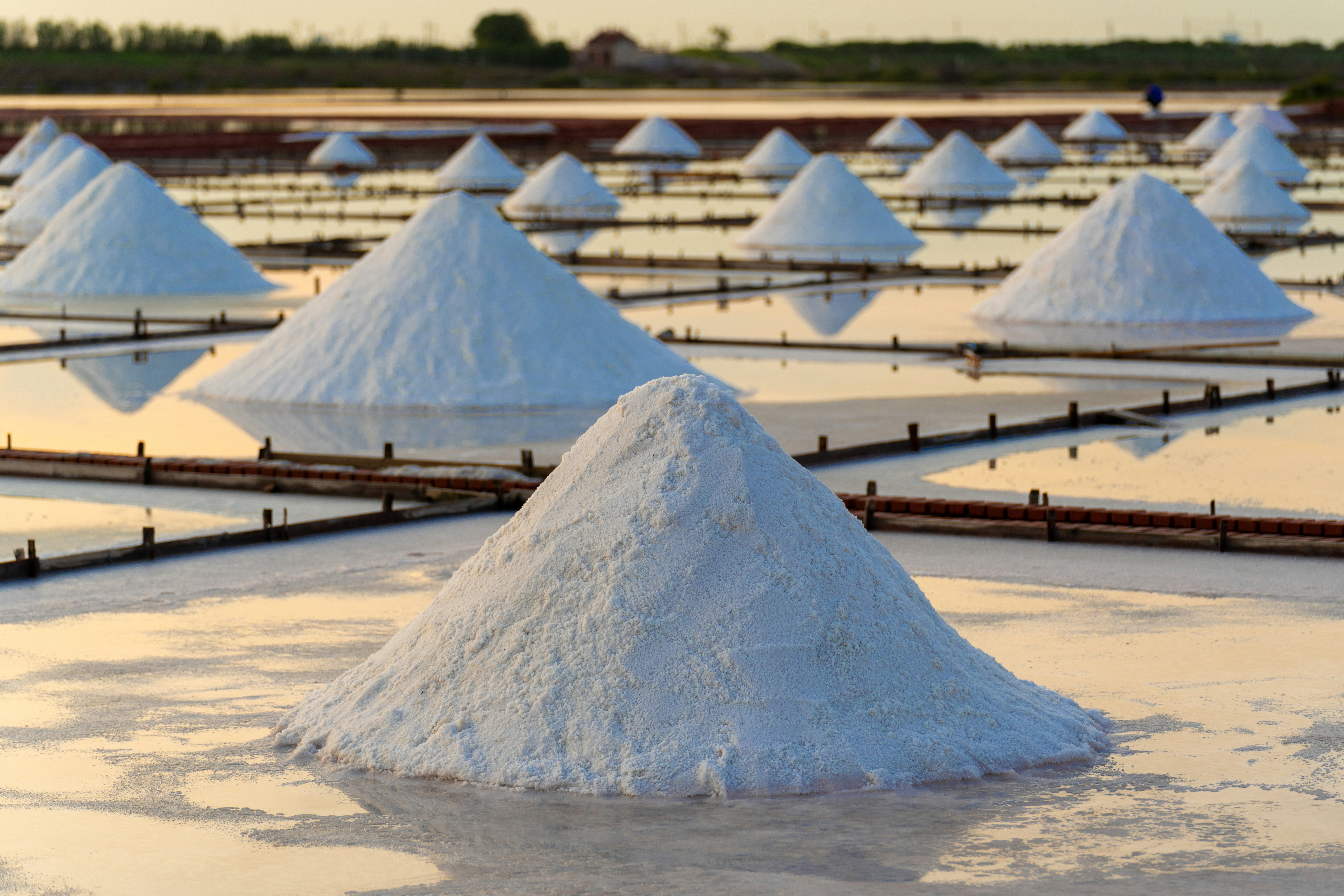 A picture of a pile of salt in a salt field. 