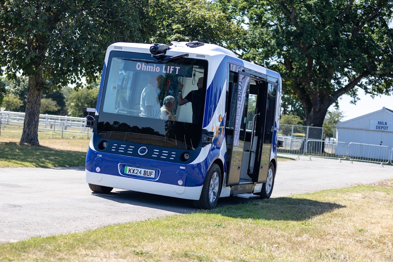 Blue and white Ohmio shuttle bus