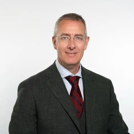 Cllr Simon Aalders wearing suit and tie