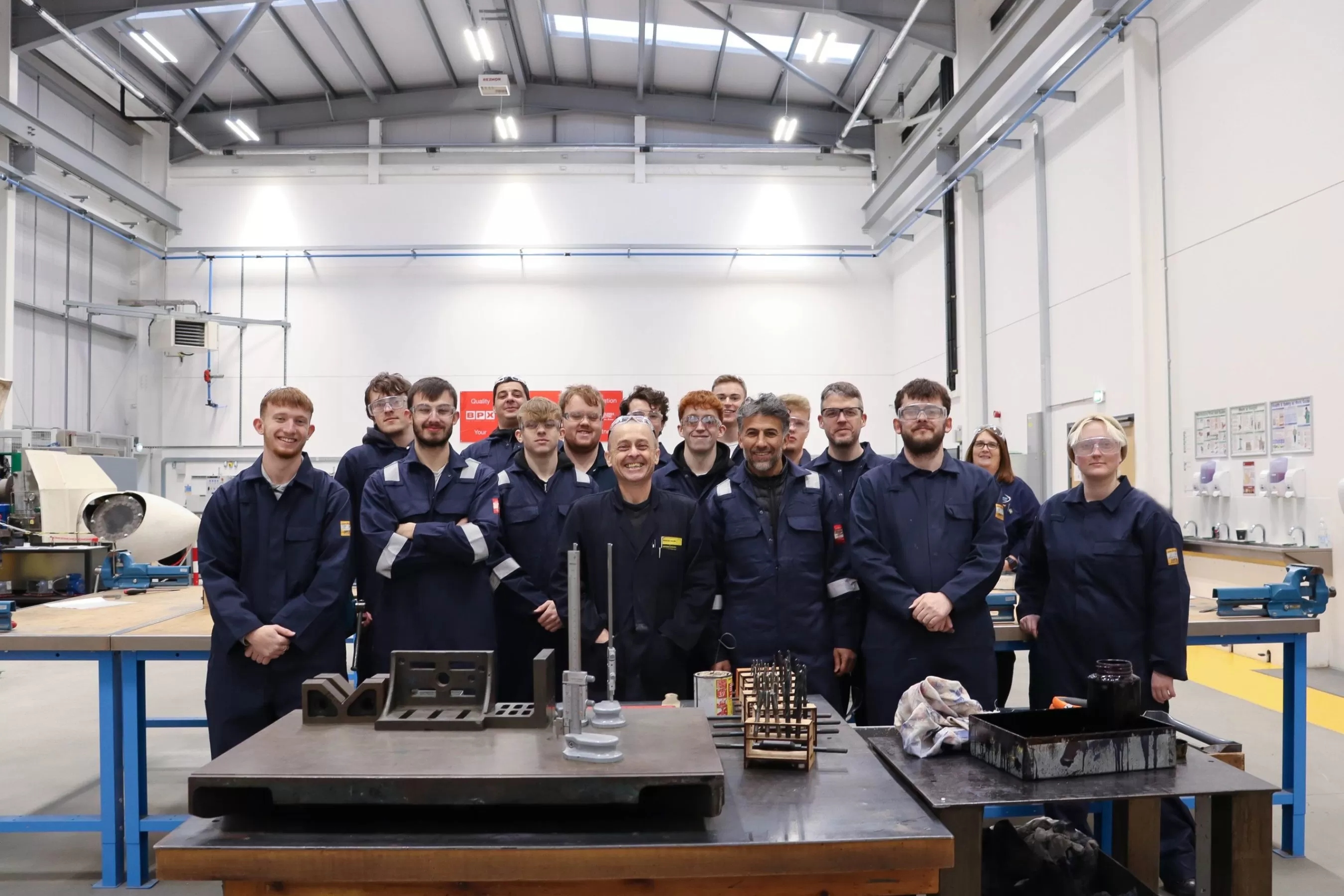 A skill bootcamp cohort standing in a workshop