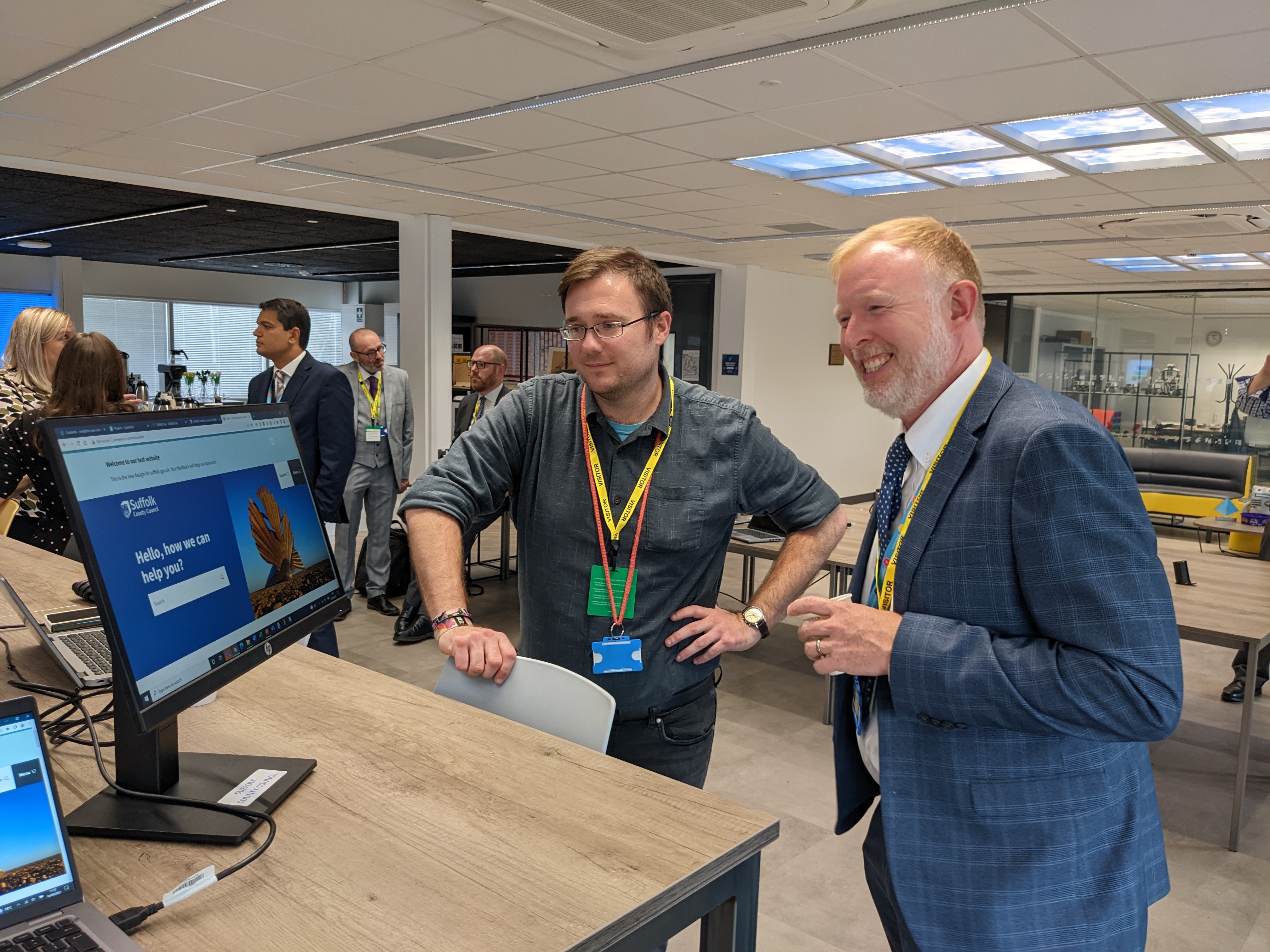Dave from the project team gathering feedback from colleagues during a staff event