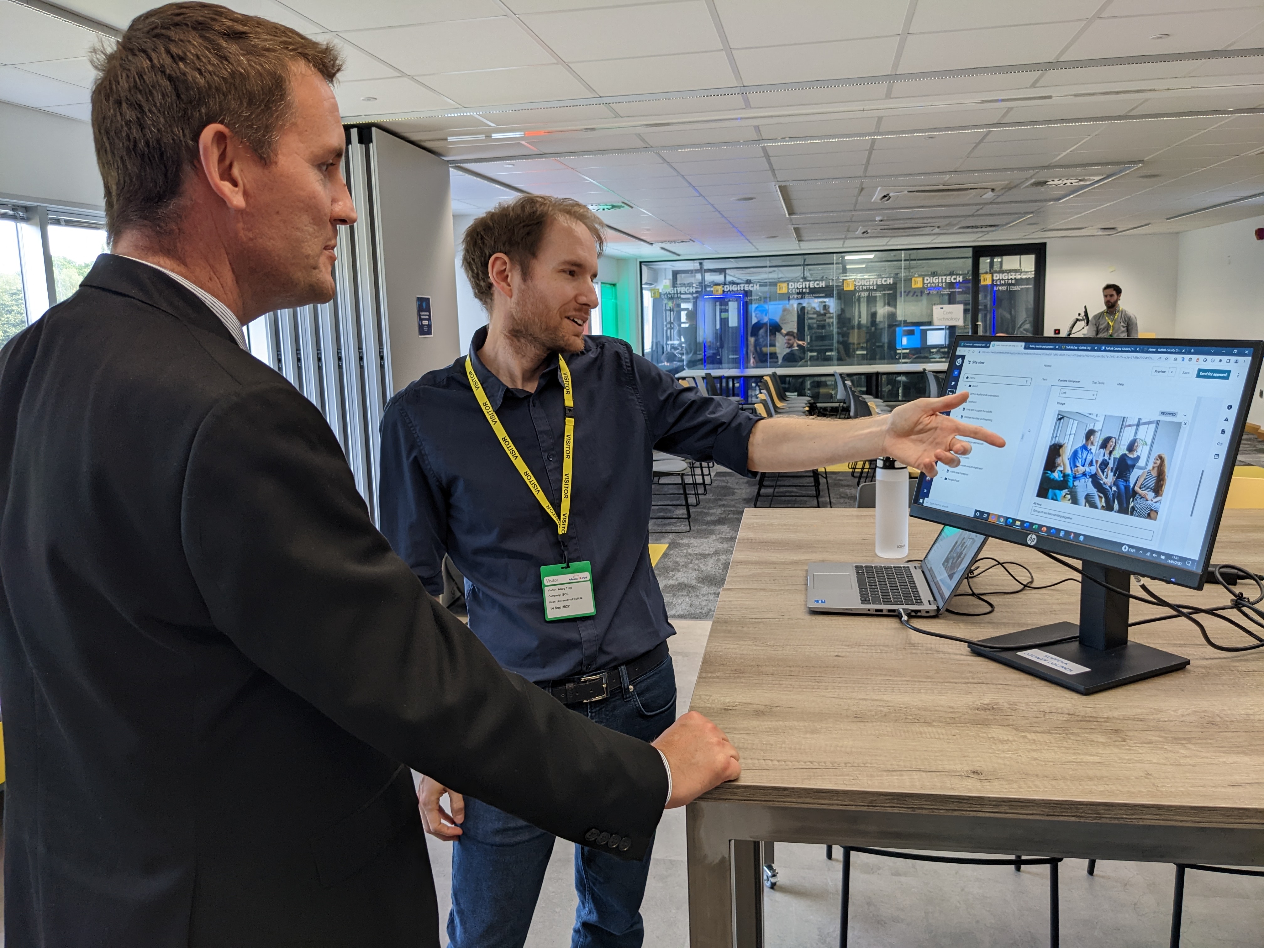 Andy from the project team gathering feedback from colleagues during a staff event