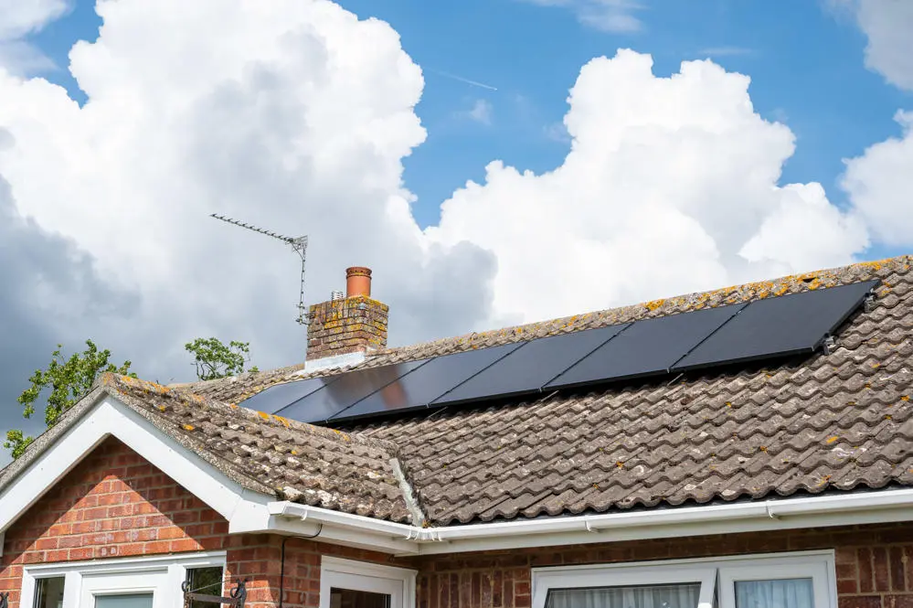 solar panels on the roof of a bungalow