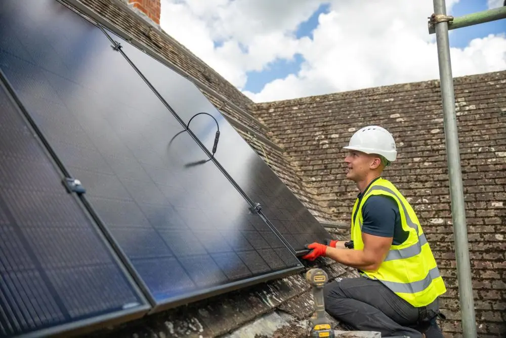solar panels being installed on a roof