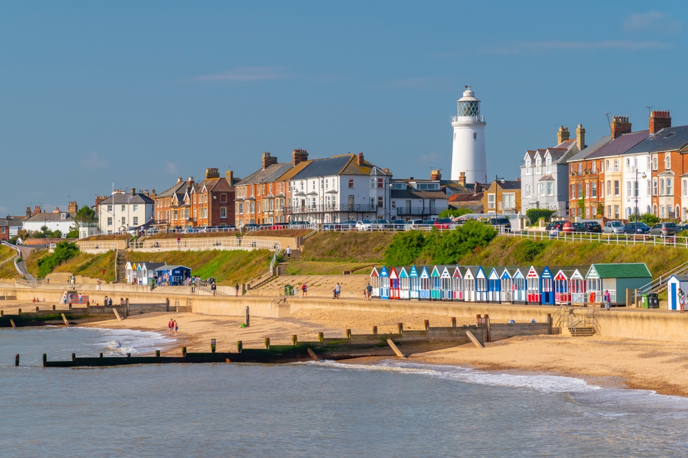 Southwold beach on a sunny day with the lighthouse overlooking the beach 