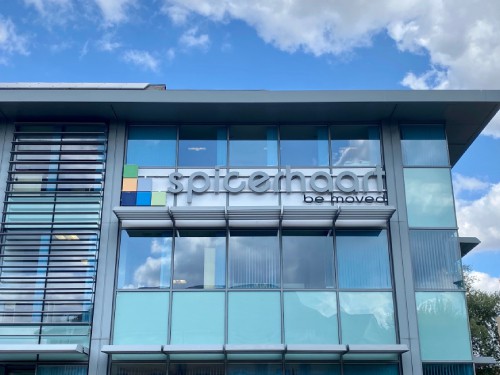 The Spicerhaart Office. A glass and grey coloured building. 