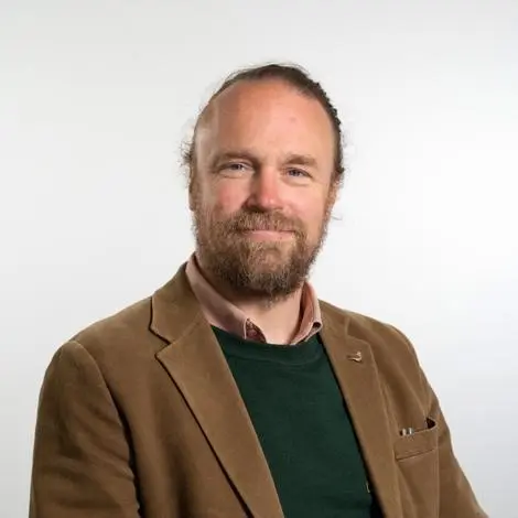Cllr Stephen Molyneux wearing brown jacket and black jumper