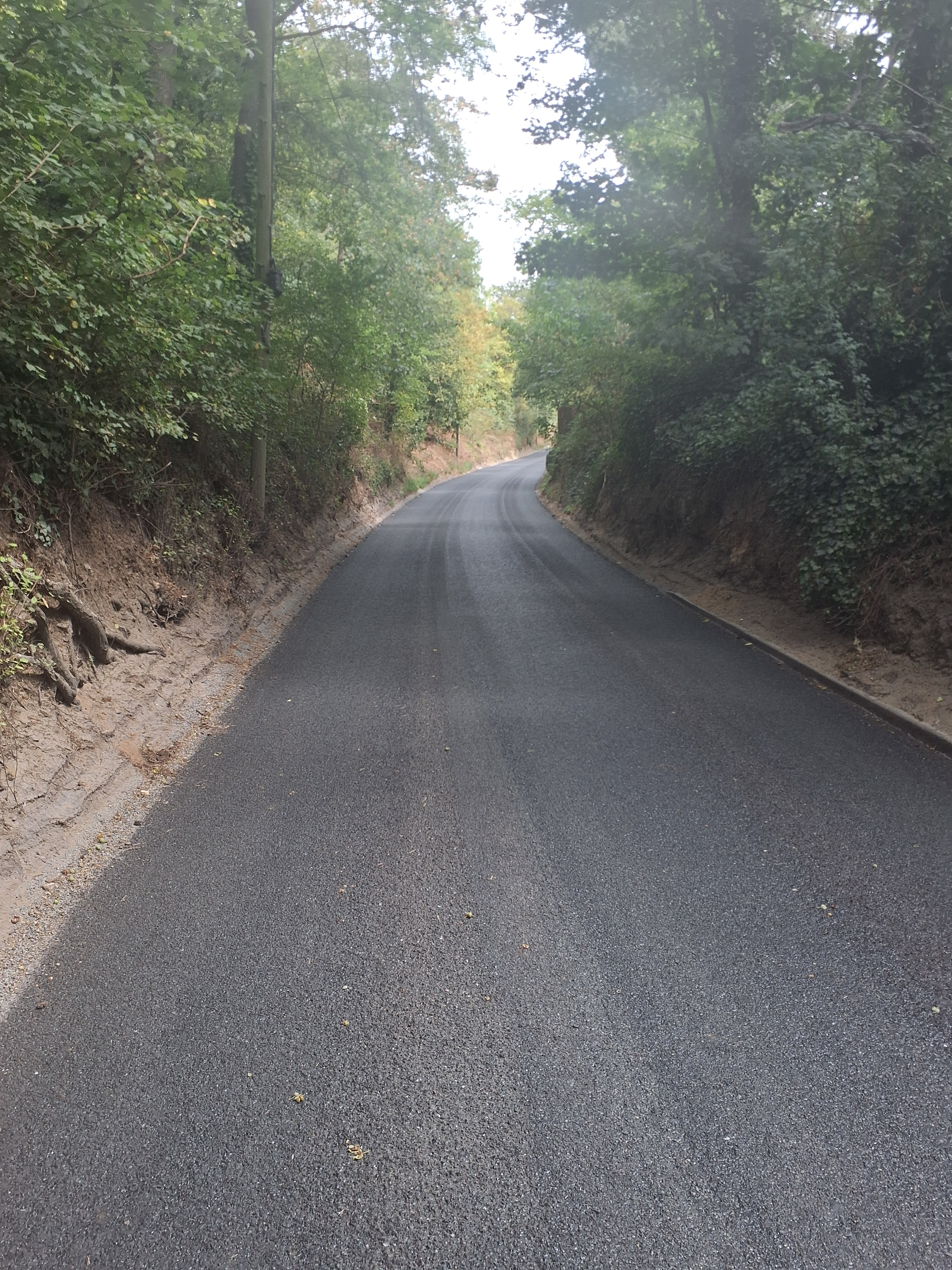 A newly surface dressed Grundisburgh Road in Tuddenham St Martin