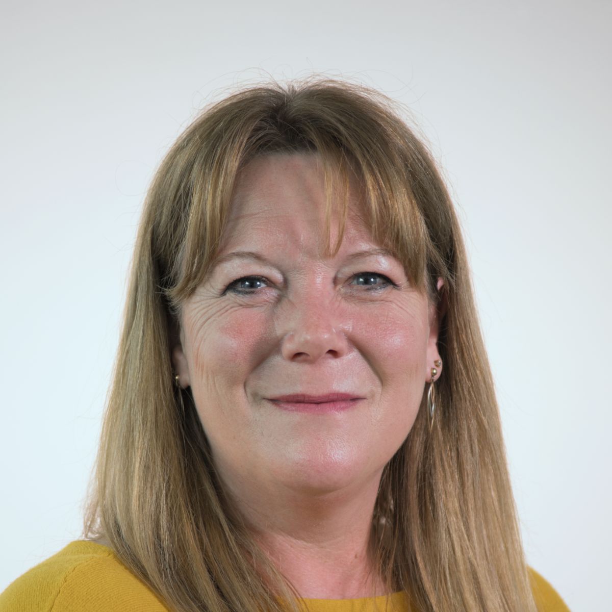 T-J Haworth-Culf, councillor wearing a yellow top. Has long blonde hair to her shoulders. 