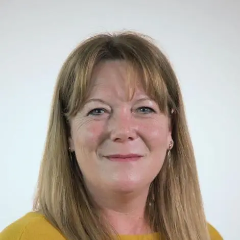 T-J Haworth-Culf, councillor wearing a yellow top. Has long blonde hair to her shoulders.