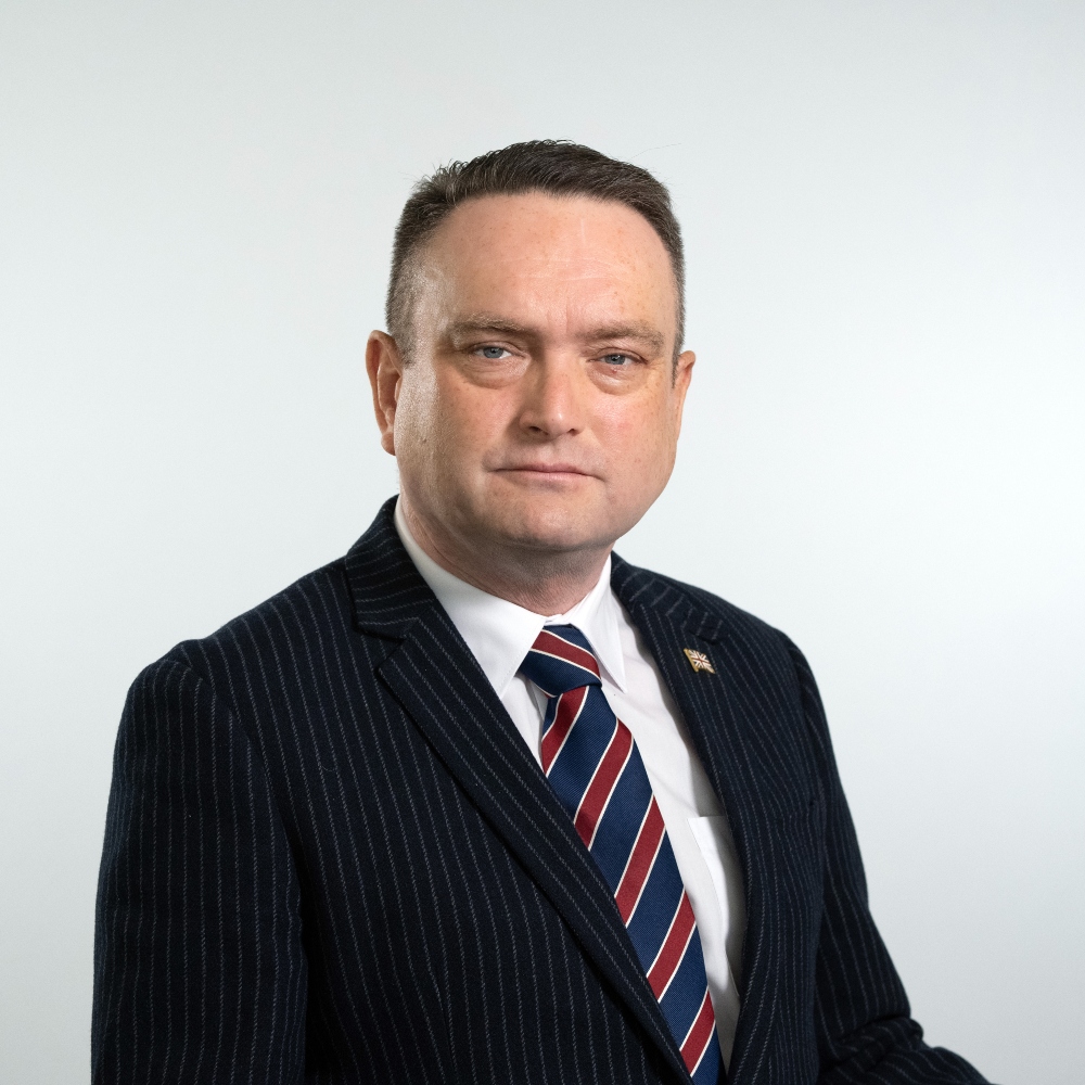 Councillor Tim Buttle wearing suit and tie
