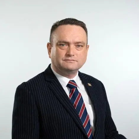 Councillor Tim Buttle wearing suit and tie