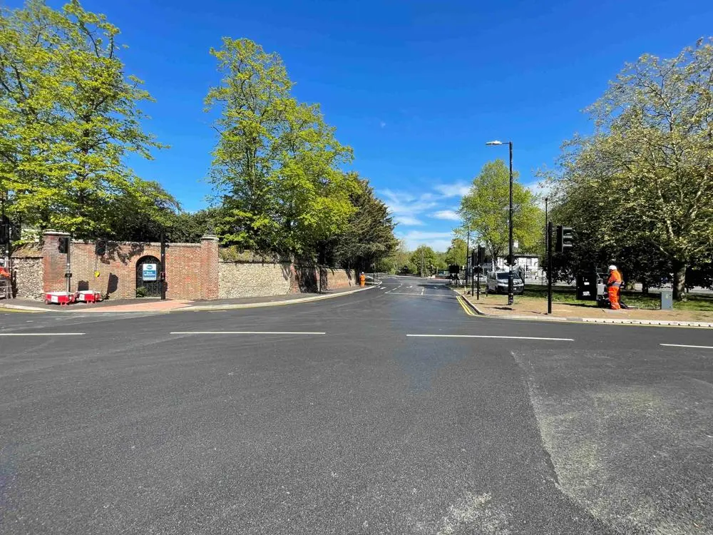 A crossroads road junction with new traffic lights.