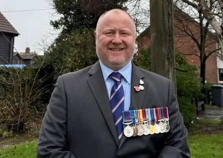 Councillor Tristan Gale wearing medals