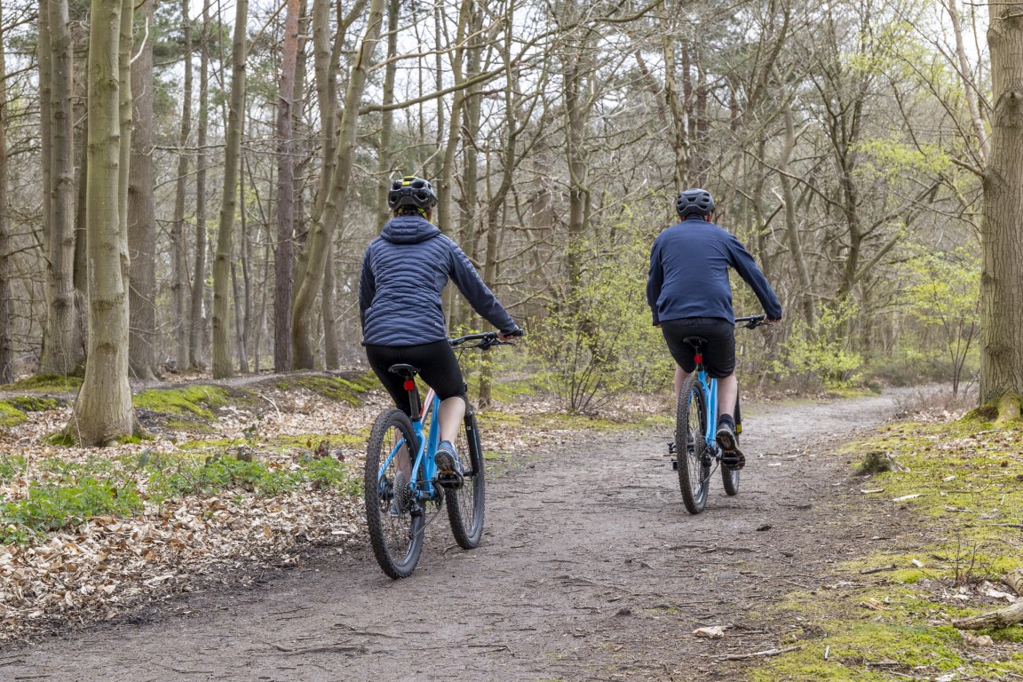 two people cycling through The Brecks