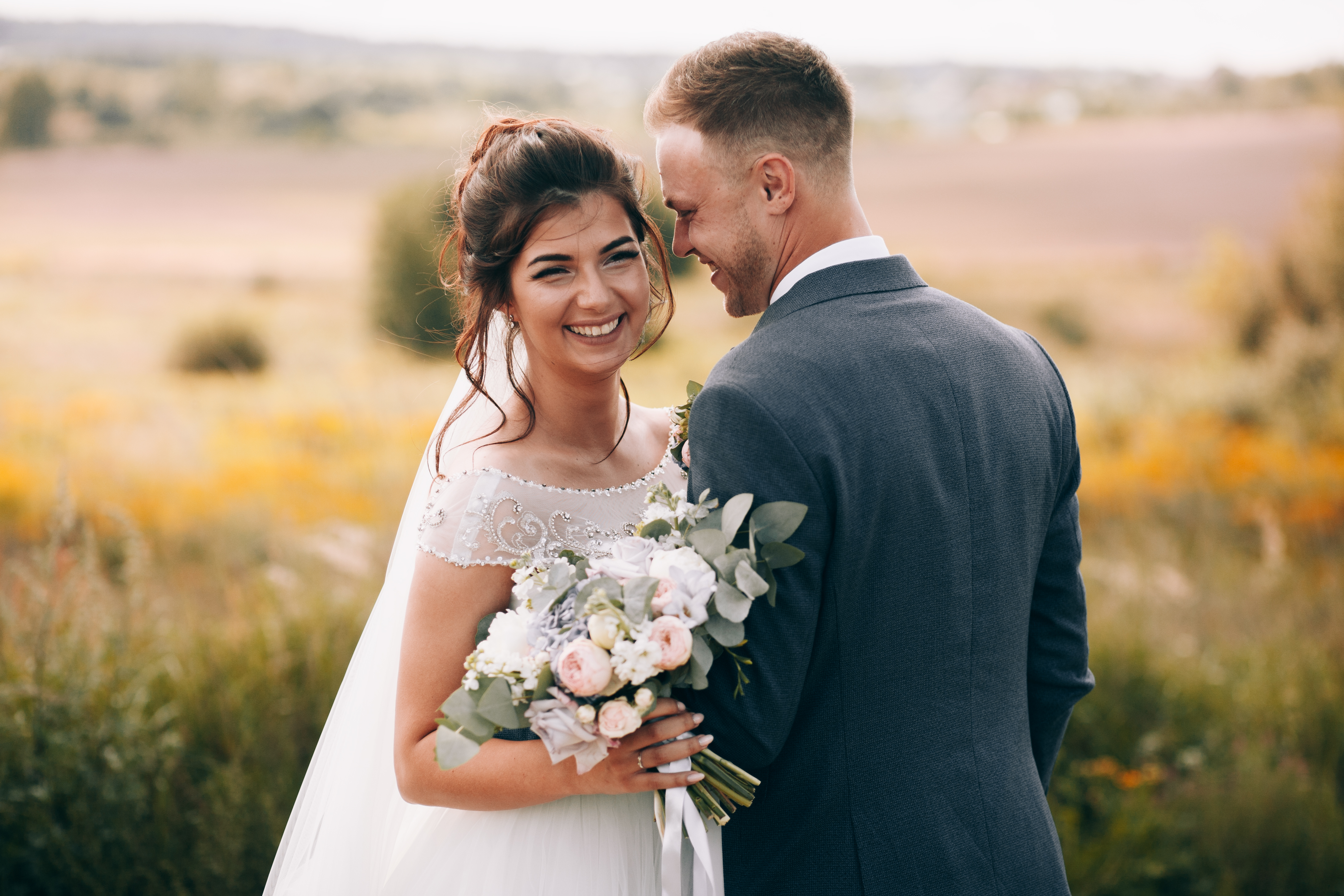 Married couple in a field. 