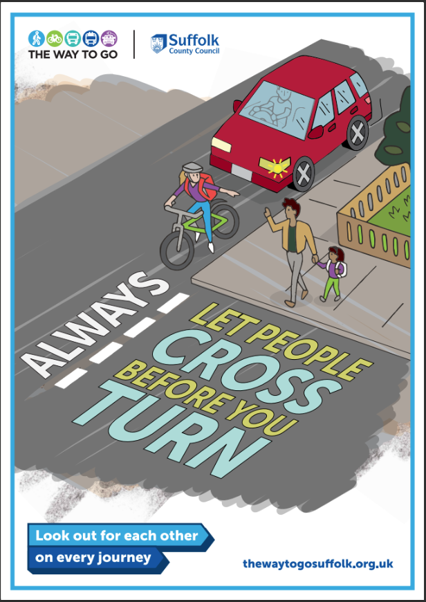 People crossing the road with vehicles and a cyclist