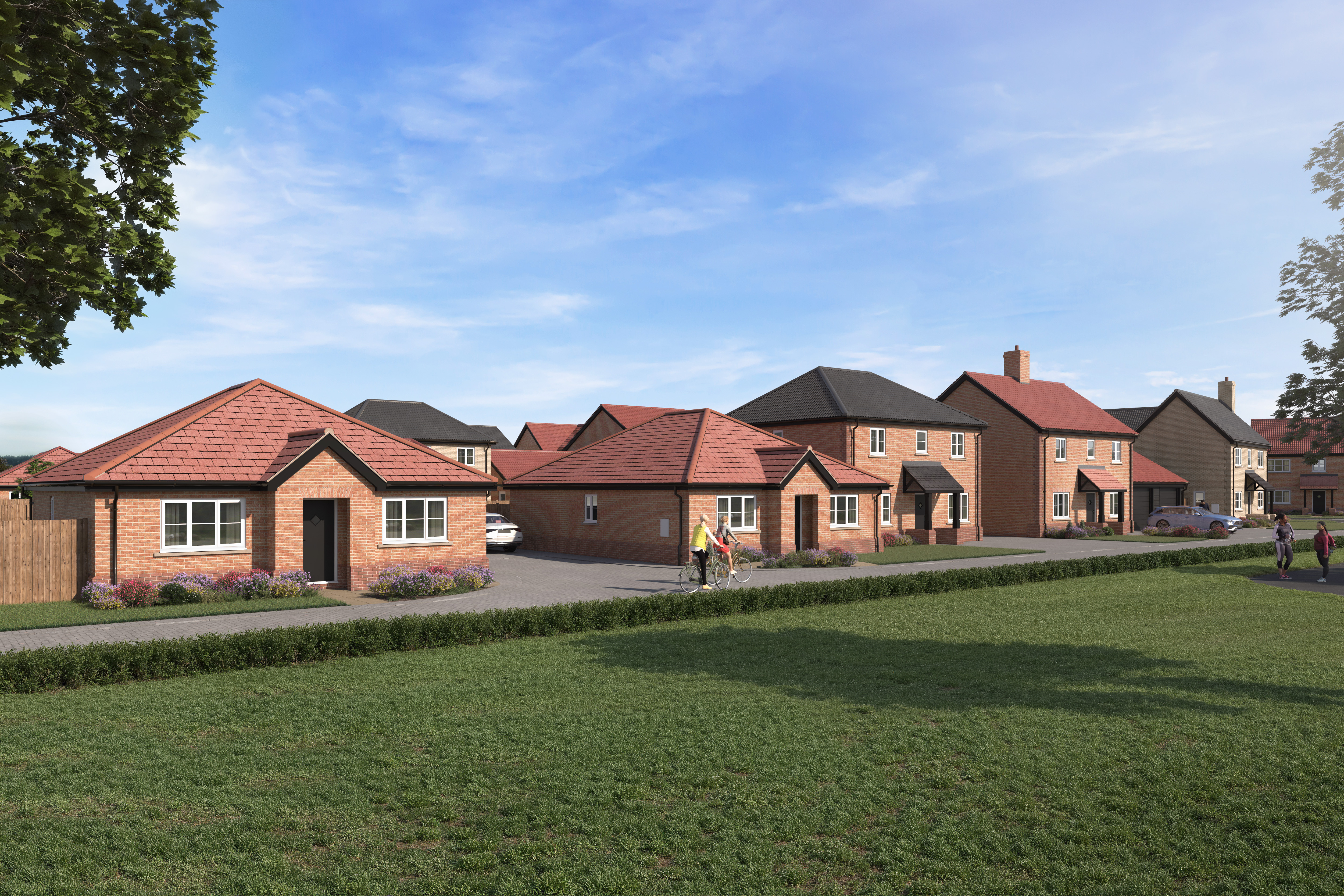 an impression of the housing development showing six homes, trees, green grass and people walking and riding bikes