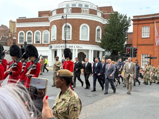 Soldiers and councillors march through Newmarket town centre.